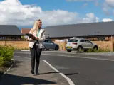 One of our Housing Advisers walking through the street holding a file